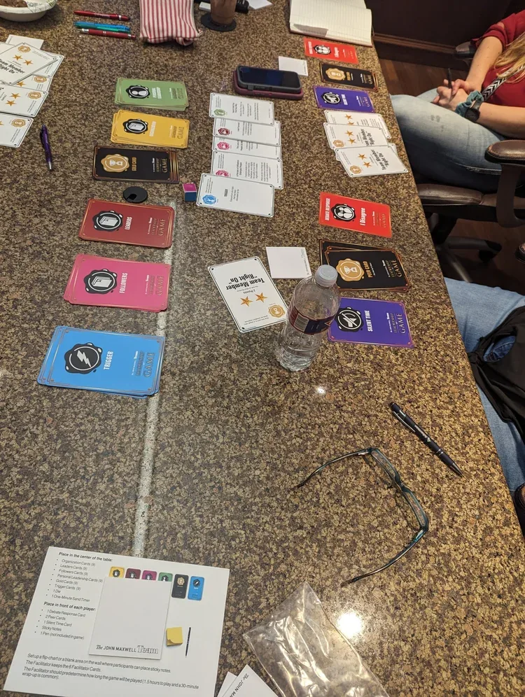 Full John Maxwell Leadership Game table set for a corporate team session